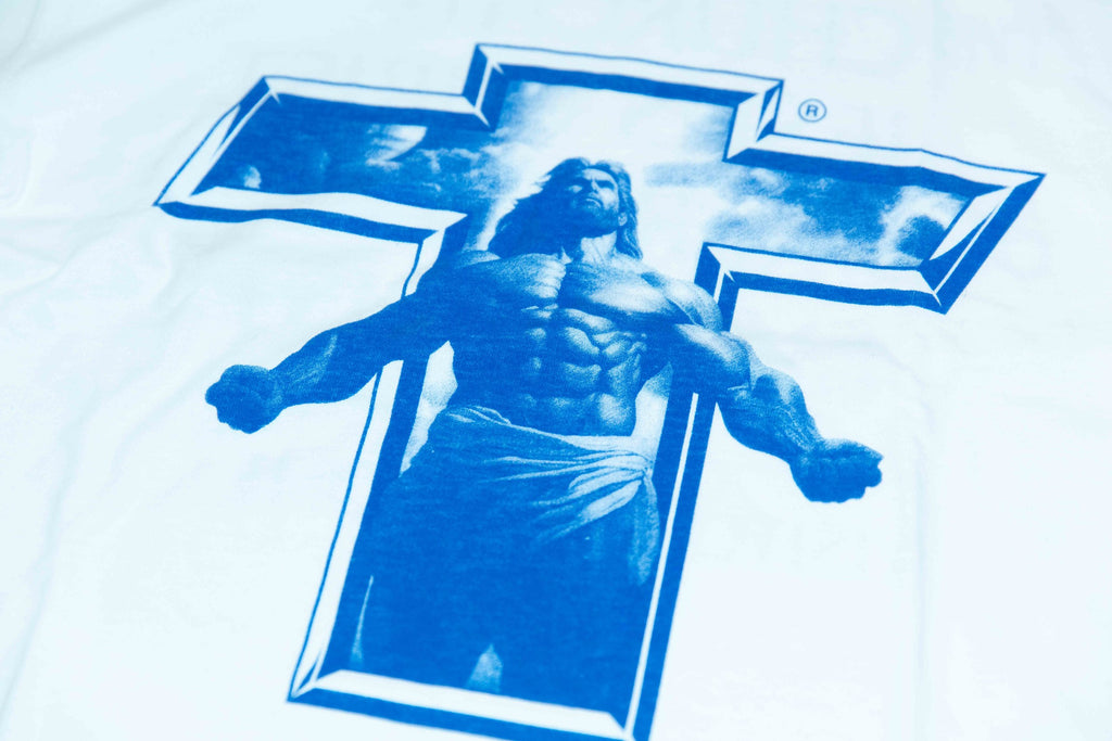 Close-up of the blue Buff Jesus screen print on a white T-shirt